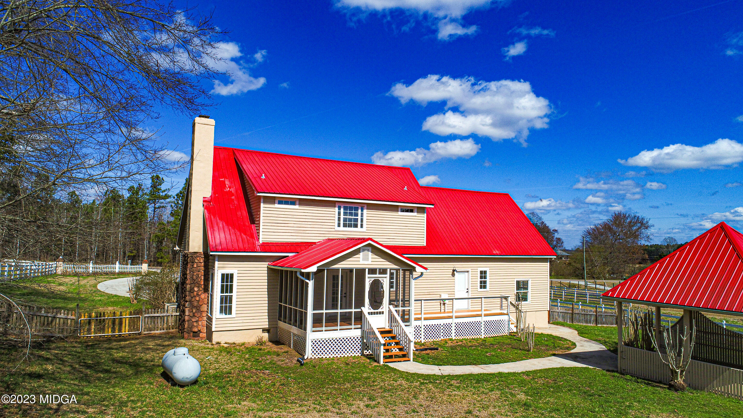 829 Lassiter Road Forsyth, GA 31029 - Photo 46 of 85 a view of a house with backyard and sitting area
