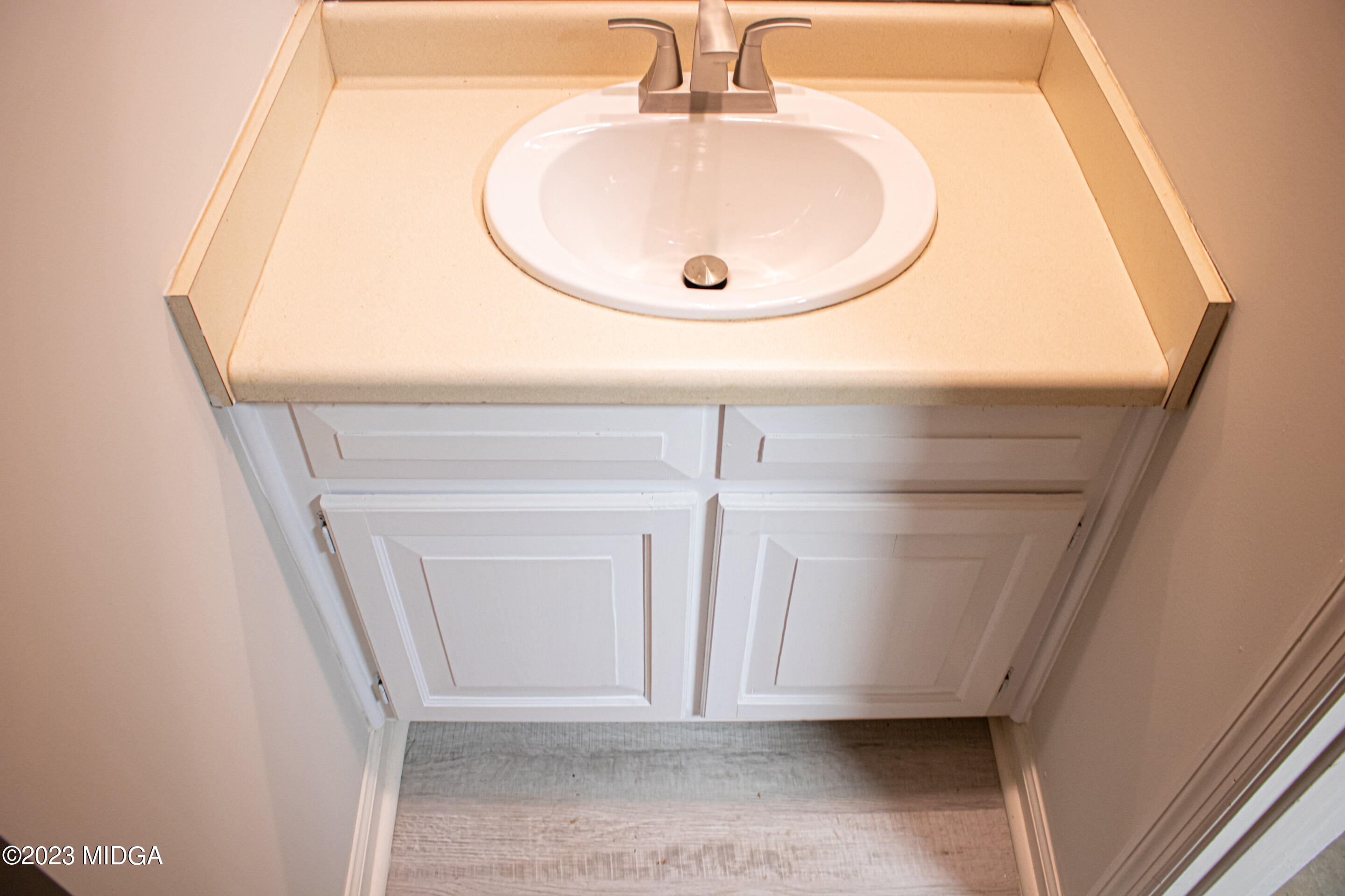 829 Lassiter Road Forsyth, GA 31029 - Photo 53 of 85 a bathroom with a sink and a mirror