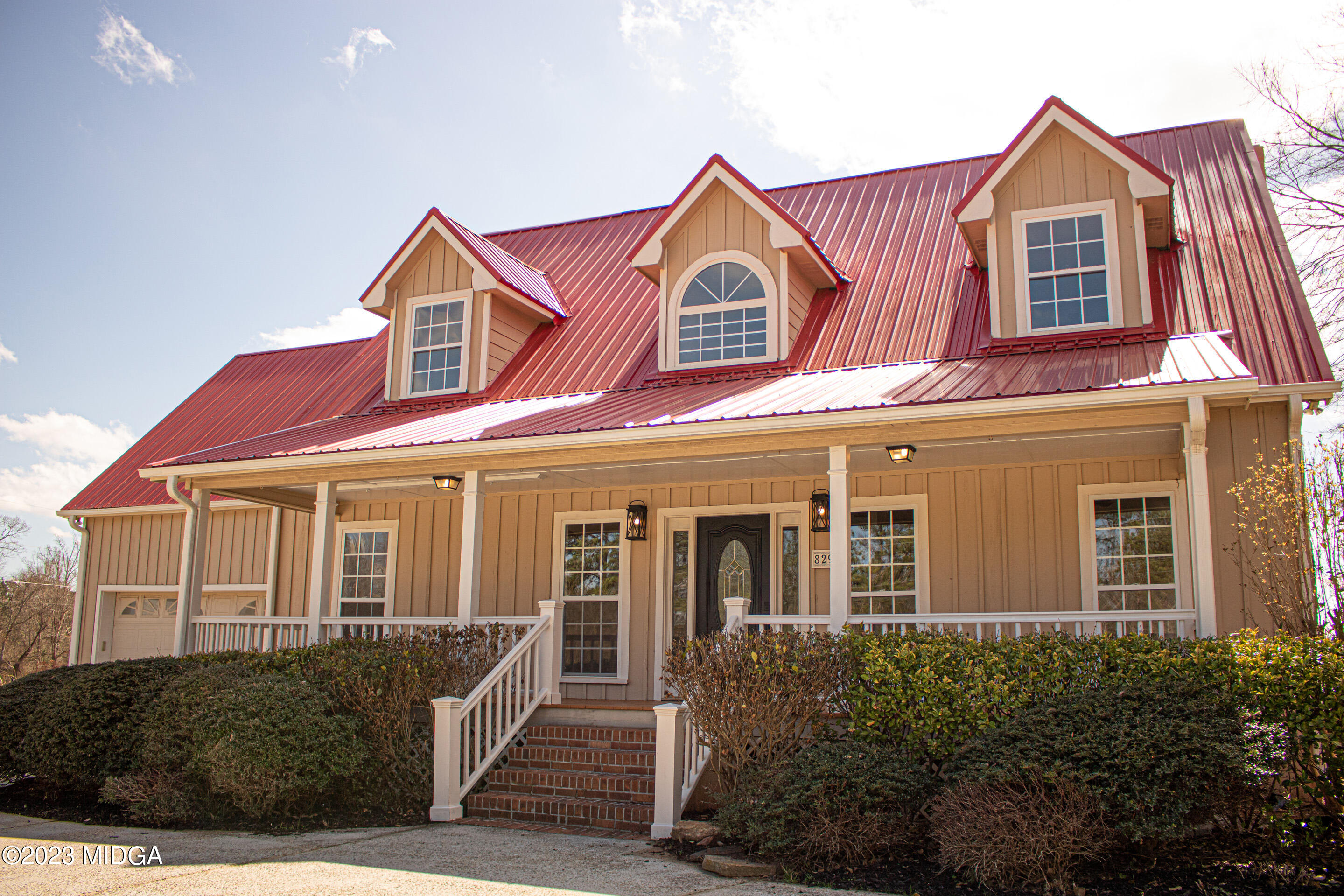 829 Lassiter Road Forsyth, GA 31029 - Photo 6 of 85 front view of a house with a yard