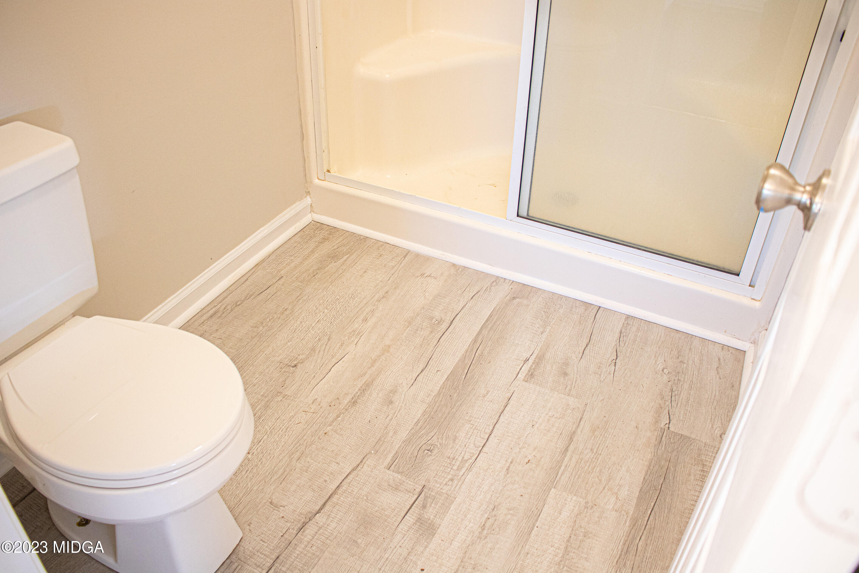 829 Lassiter Road Forsyth, GA 31029 - Photo 64 of 85 a bathroom with a toilet and a sink
