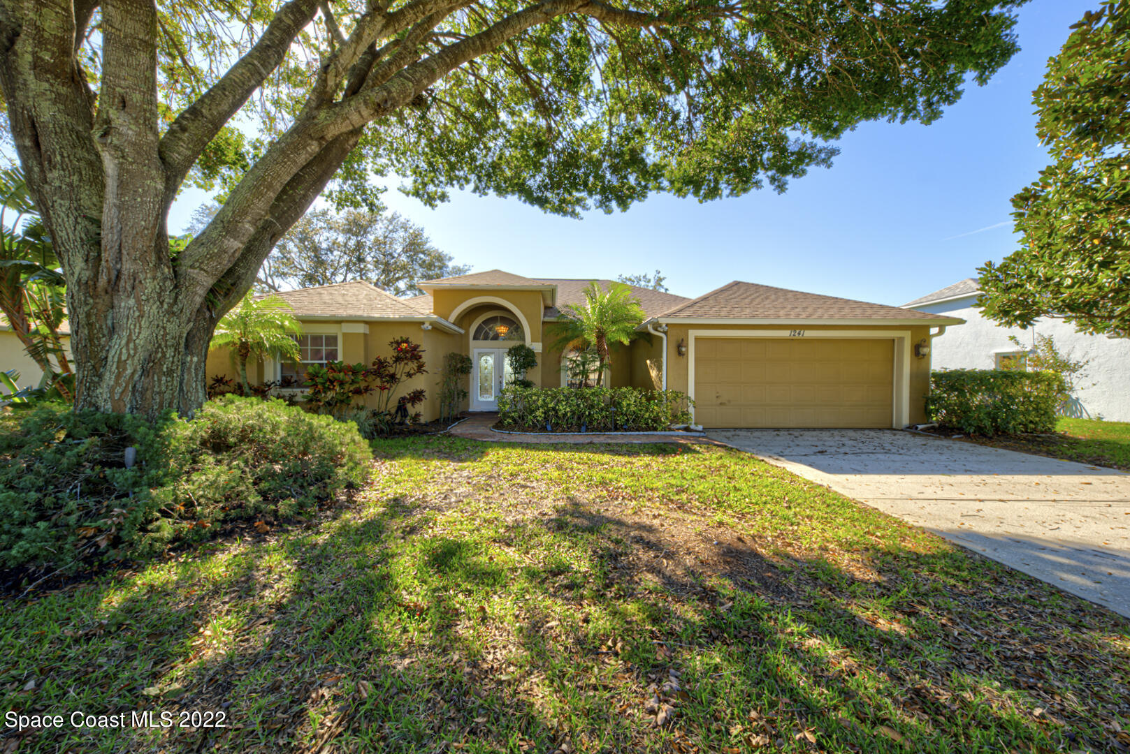 1241 Winding Meadows Road Rockledge, FL 32955 - Photo 1 of 54 front of house with oak tree
