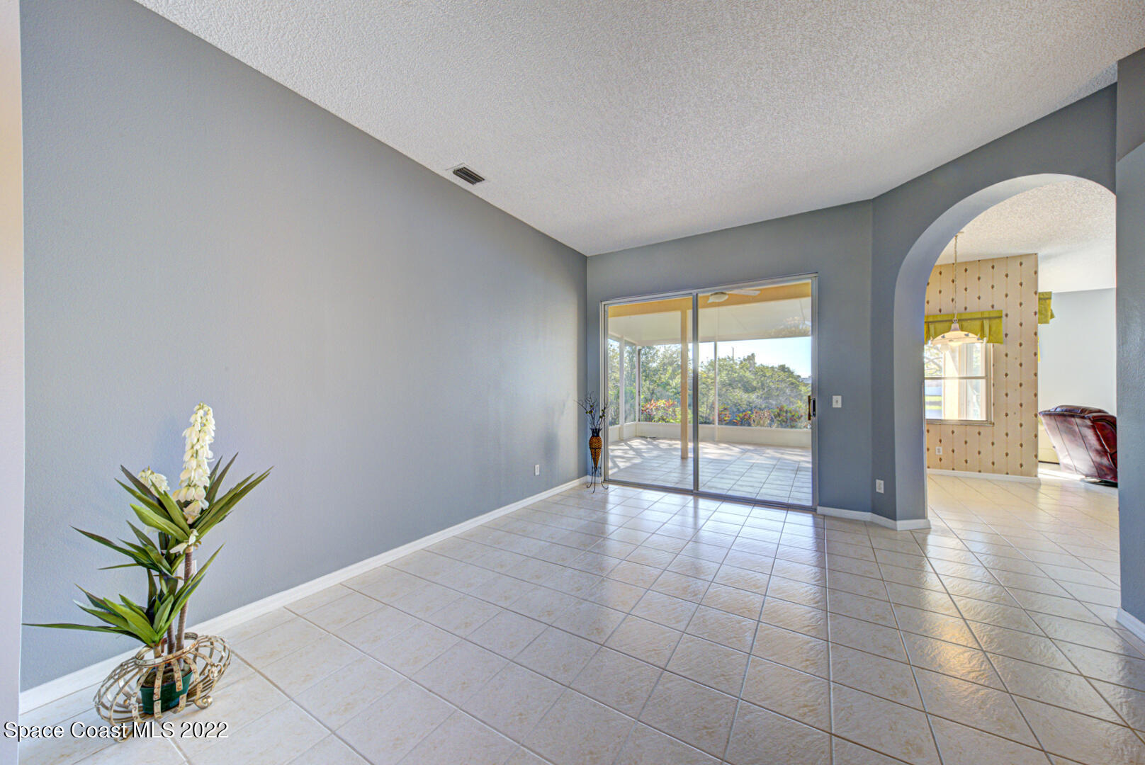 1241 Winding Meadows Road Rockledge, FL 32955 - Photo 13 of 54 living room with slider to porch