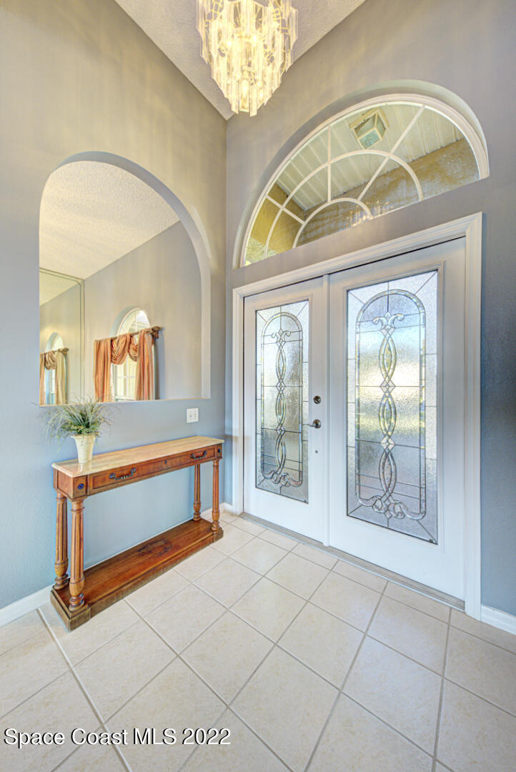 1241 Winding Meadows Road Rockledge, FL 32955 - Photo 15 of 54 foyer with chandelier