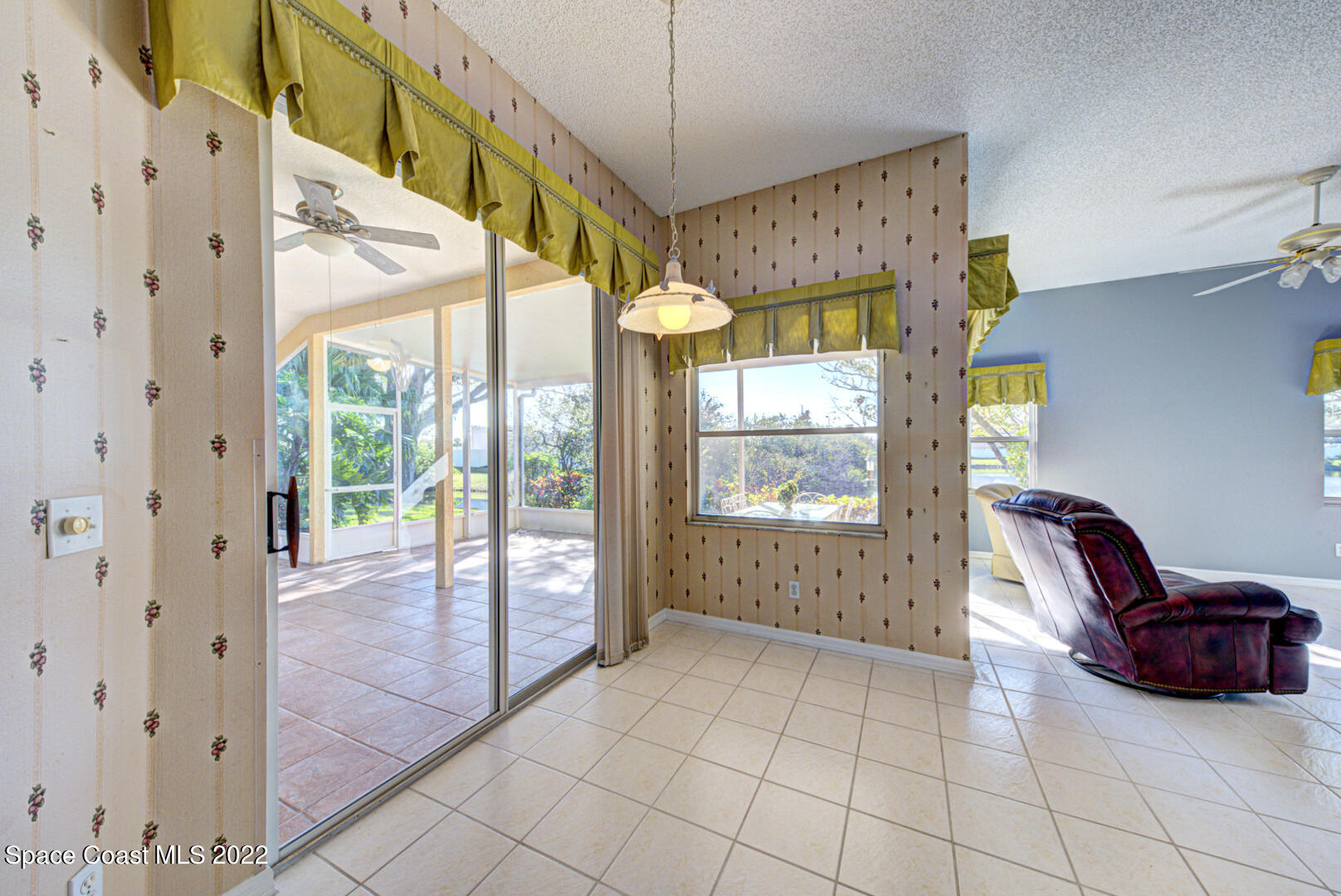1241 Winding Meadows Road Rockledge, FL 32955 - Photo 22 of 54 breakfast nook with slider to porch