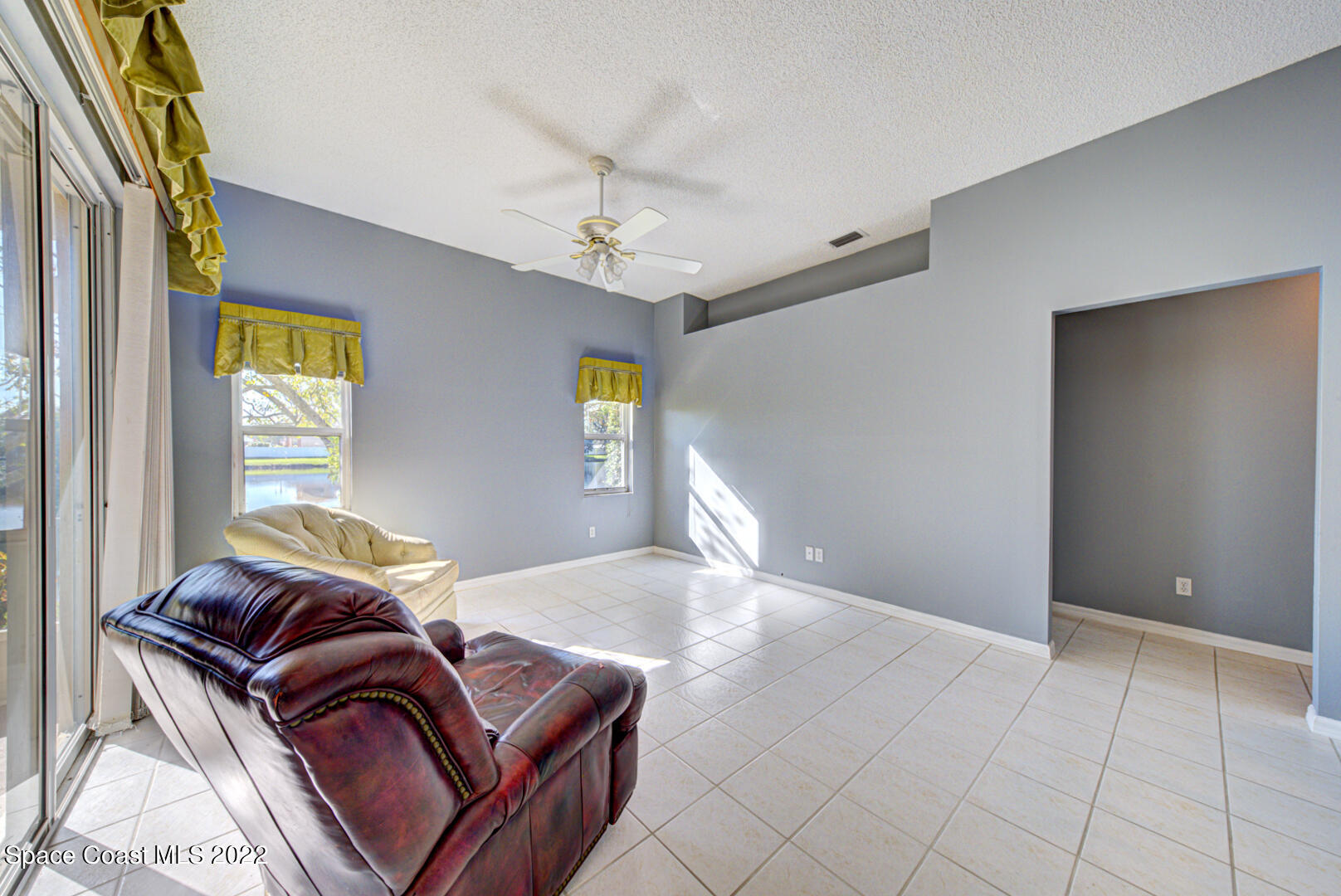 1241 Winding Meadows Road Rockledge, FL 32955 - Photo 25 of 54 family room with tile floor