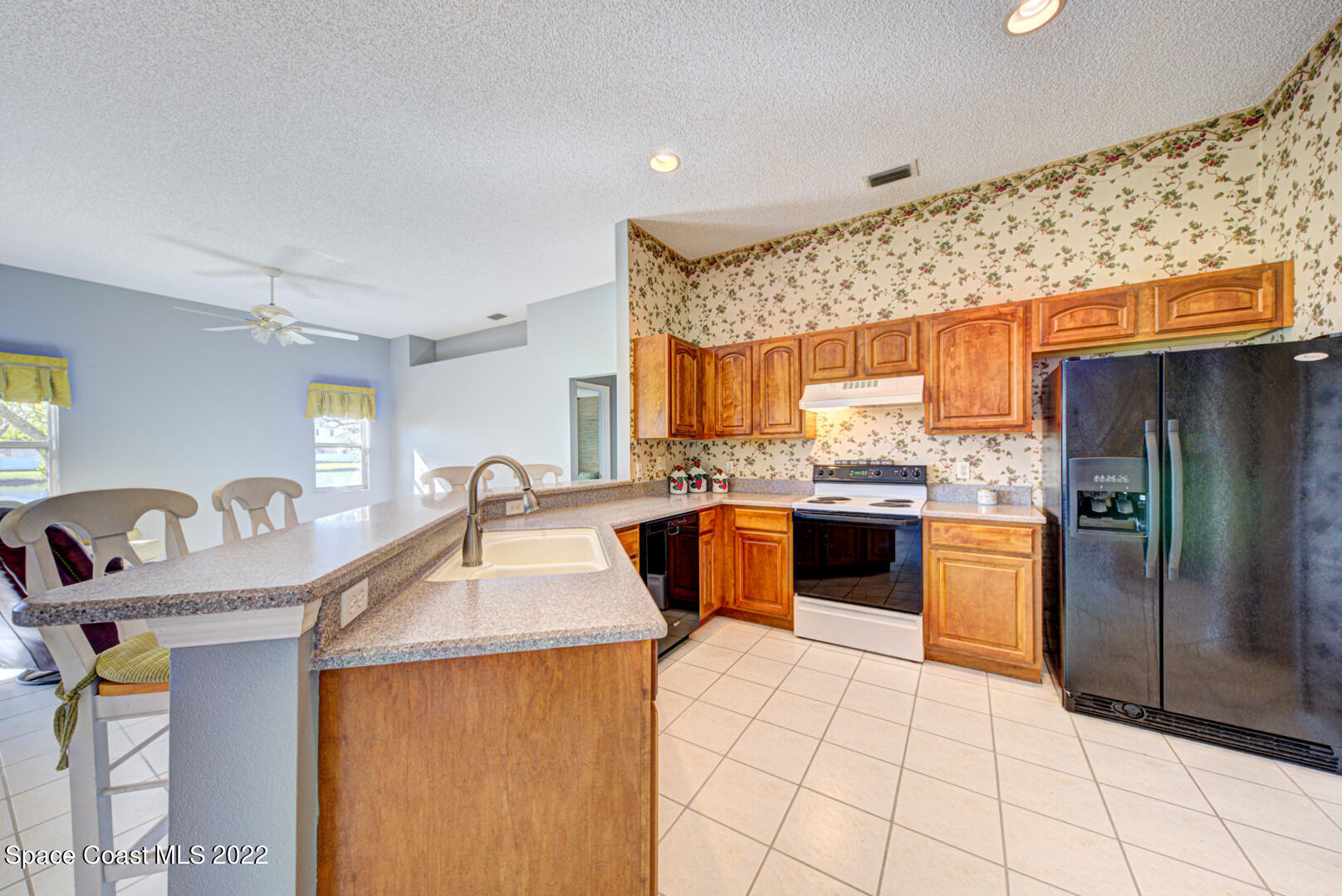 1241 Winding Meadows Road Rockledge, FL 32955 - Photo 29 of 54 kitchen with breakfast bar