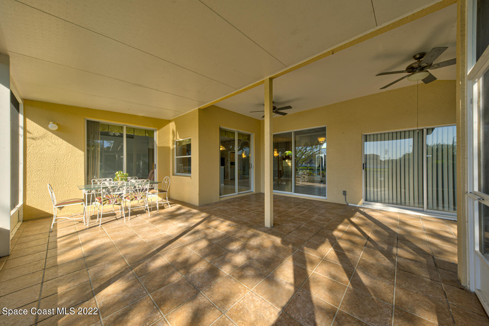 1241 Winding Meadows Road Rockledge, FL 32955 - Photo 49 of 54 screened-in back porch with fans