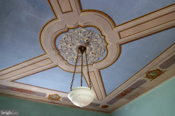 a view of empty room with ceiling fan