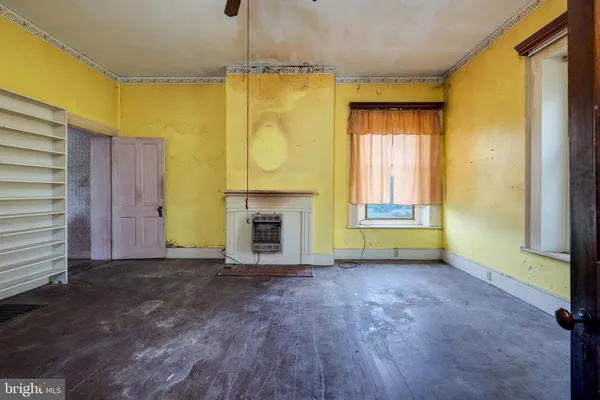 a view of front door with furniture and a window