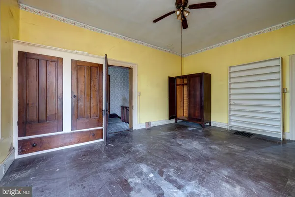 a bedroom with bed and window