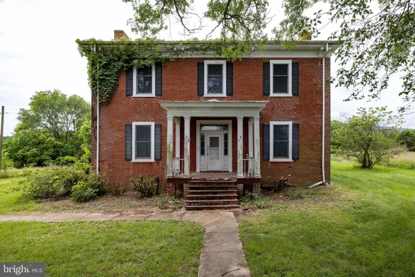 an aerial view of a house with a garden