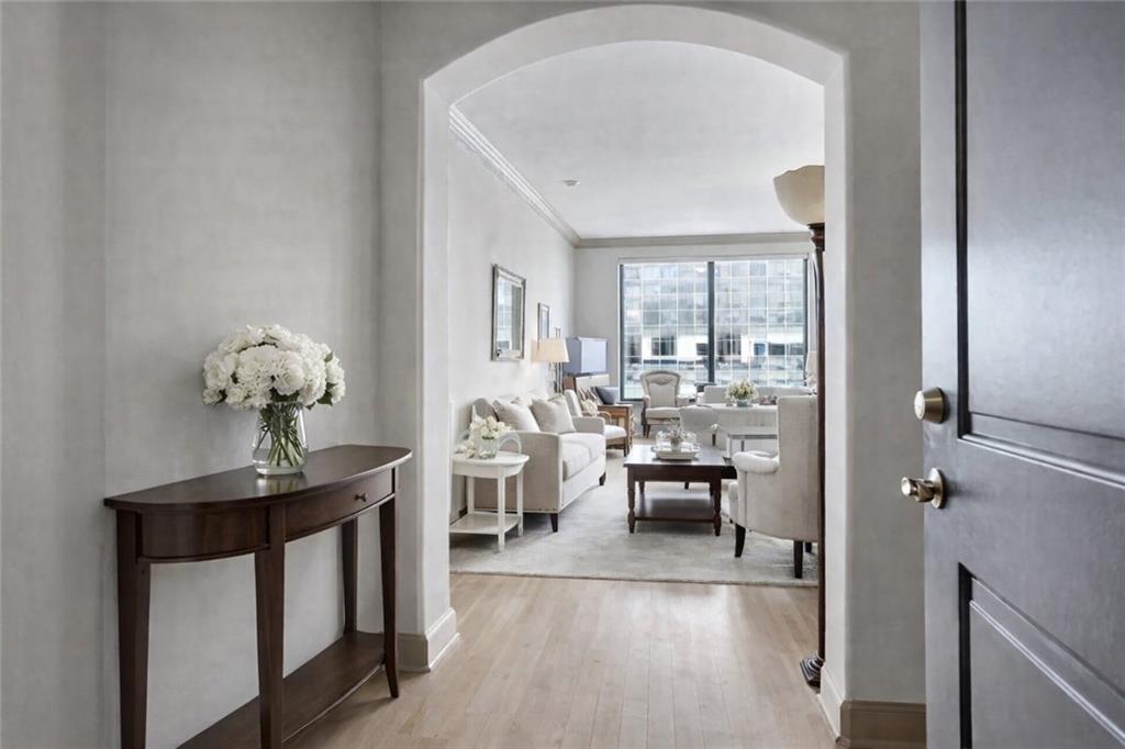 a view of a dining room with furniture wooden floor and a chandelier