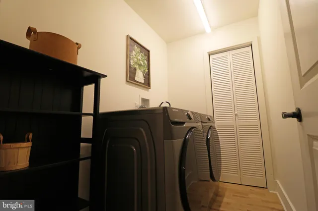 a bathroom with a shower and a sink