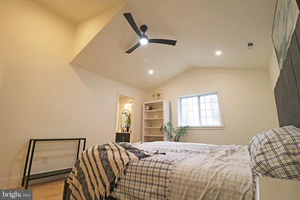 a view of empty room with ceiling fan