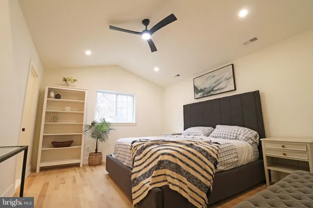 a kitchen with stainless steel appliances kitchen island granite countertop a stove a sink and a refrigerator