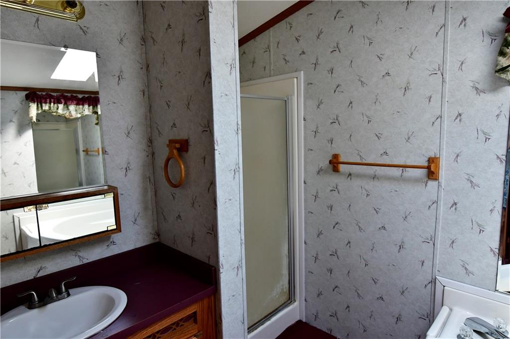 604 Deana Way Rochester, PA 15074 - Photo 8 of 22 a bathroom with a sink and a mirror