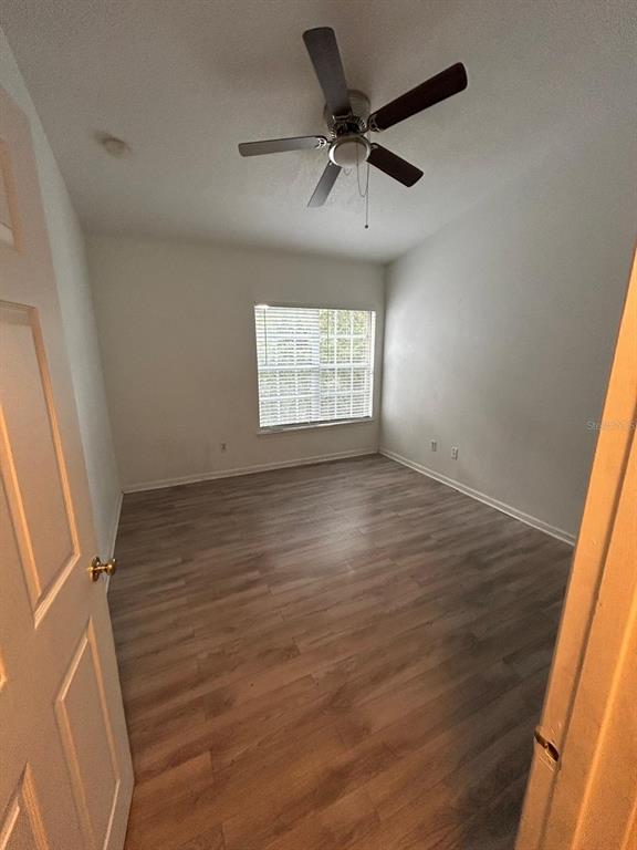4320 South Kirkman Road, Unit 1 Orlando, FL 32811 - Photo 6 of 10 an empty room with a window