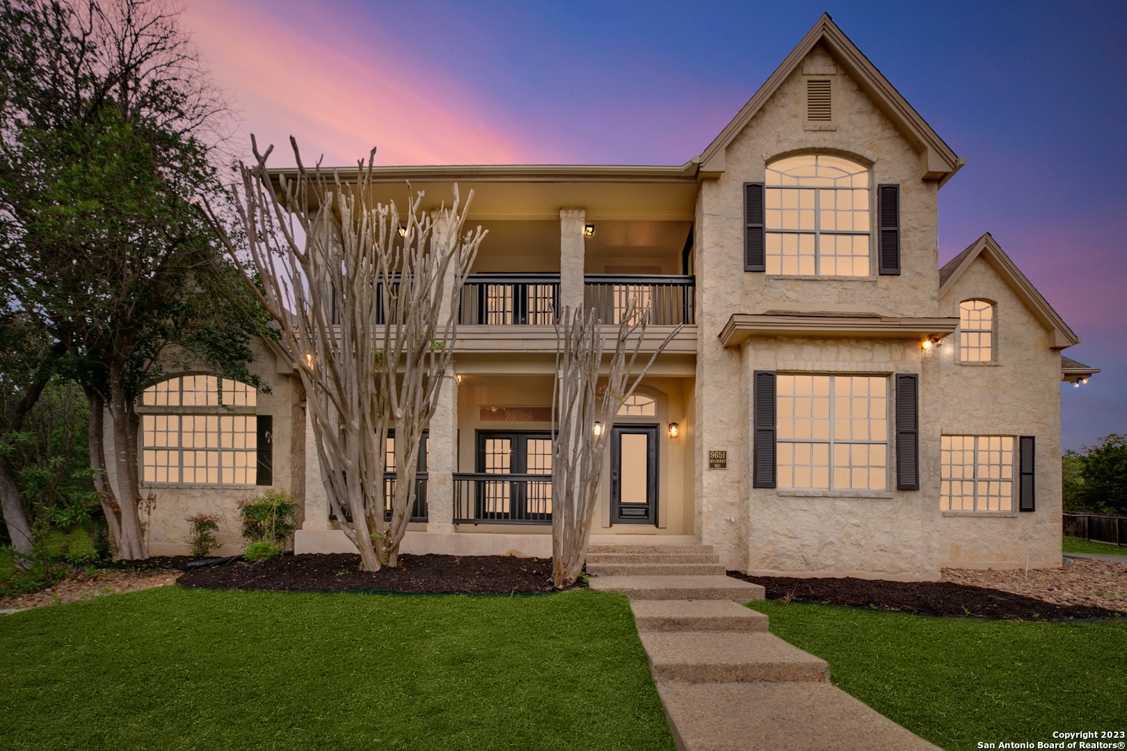 a front view of a house with a yard
