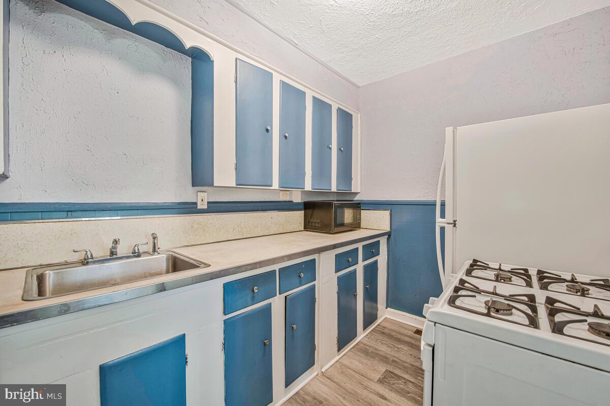 9425 Washington Boulevard Lanham, MD 20706 - Photo 16 of 38 a view of a kitchen with sink and cabinets