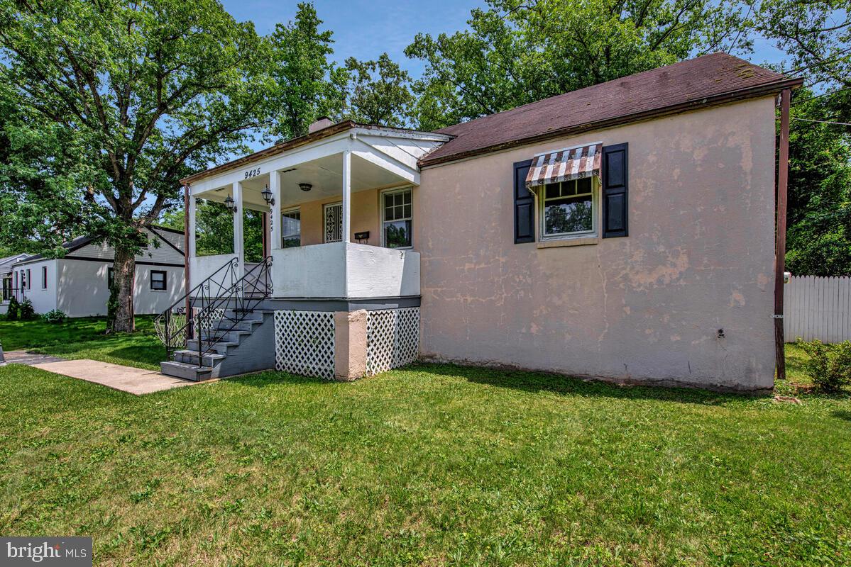9425 Washington Boulevard Lanham, MD 20706 - Photo 3 of 38 a front view of house with yard and green space