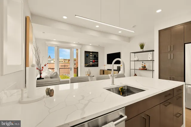 a kitchen with a sink and a refrigerator