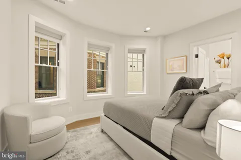 a living room with furniture and windows