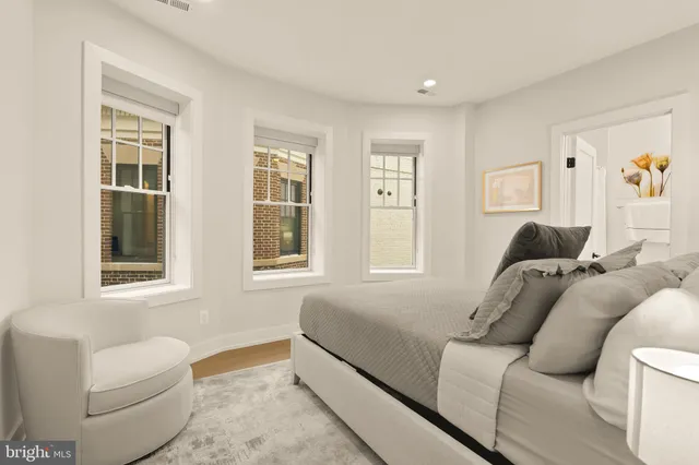 a living room with furniture and windows