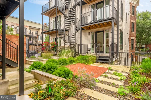 a view of a building with a yard