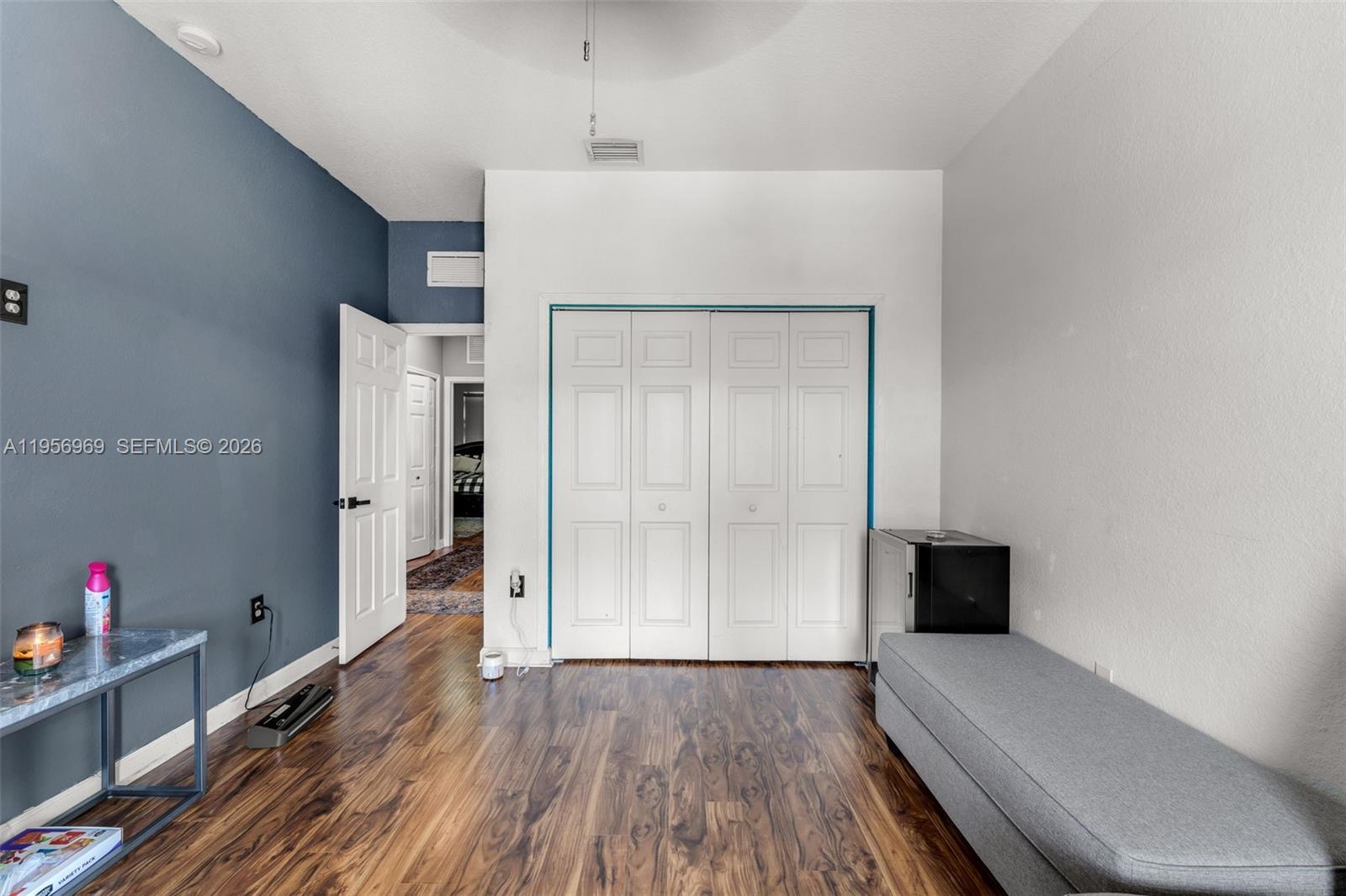 12965 Southwest 133rd Terrace Miami, FL 33186 - Photo 16 of 42 a view of hallway with wooden floor