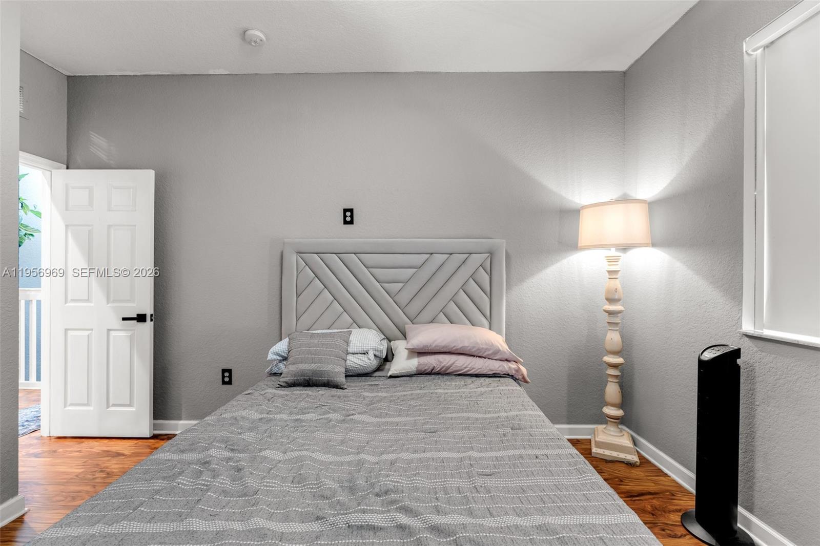 12965 Southwest 133rd Terrace Miami, FL 33186 - Photo 18 of 42 a bedroom with a bed and a walk in closet