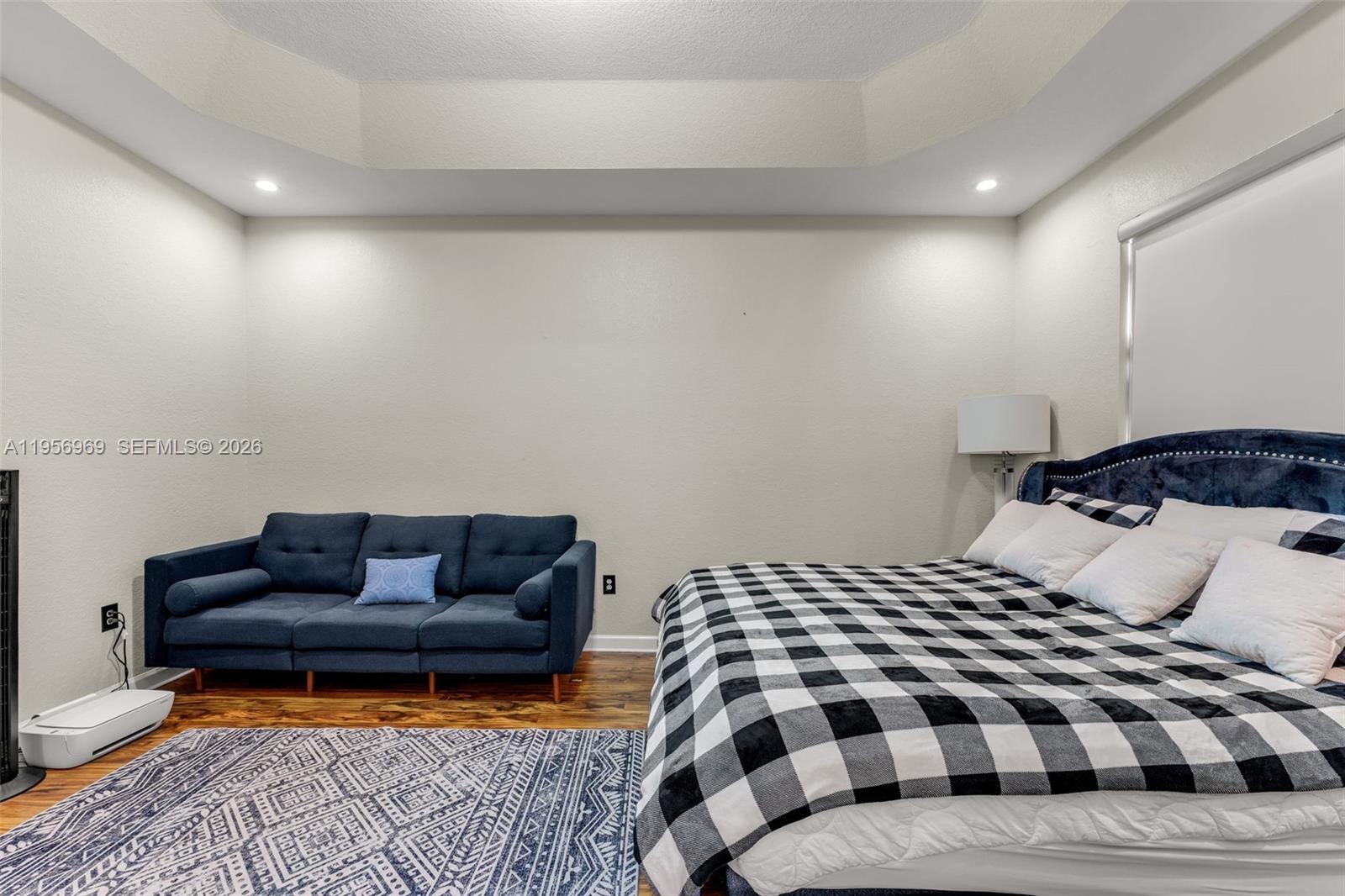 12965 Southwest 133rd Terrace Miami, FL 33186 - Photo 23 of 42 a bedroom with a bed and a couch