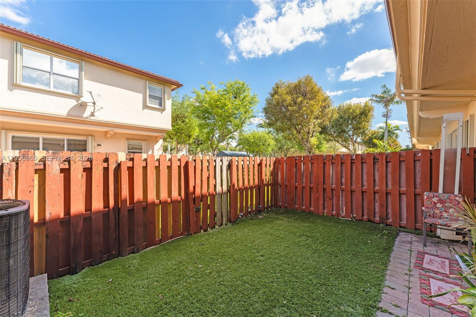 12965 Southwest 133rd Terrace Miami, FL 33186 - Photo 28 of 42 a view of a backyard with wooden fence