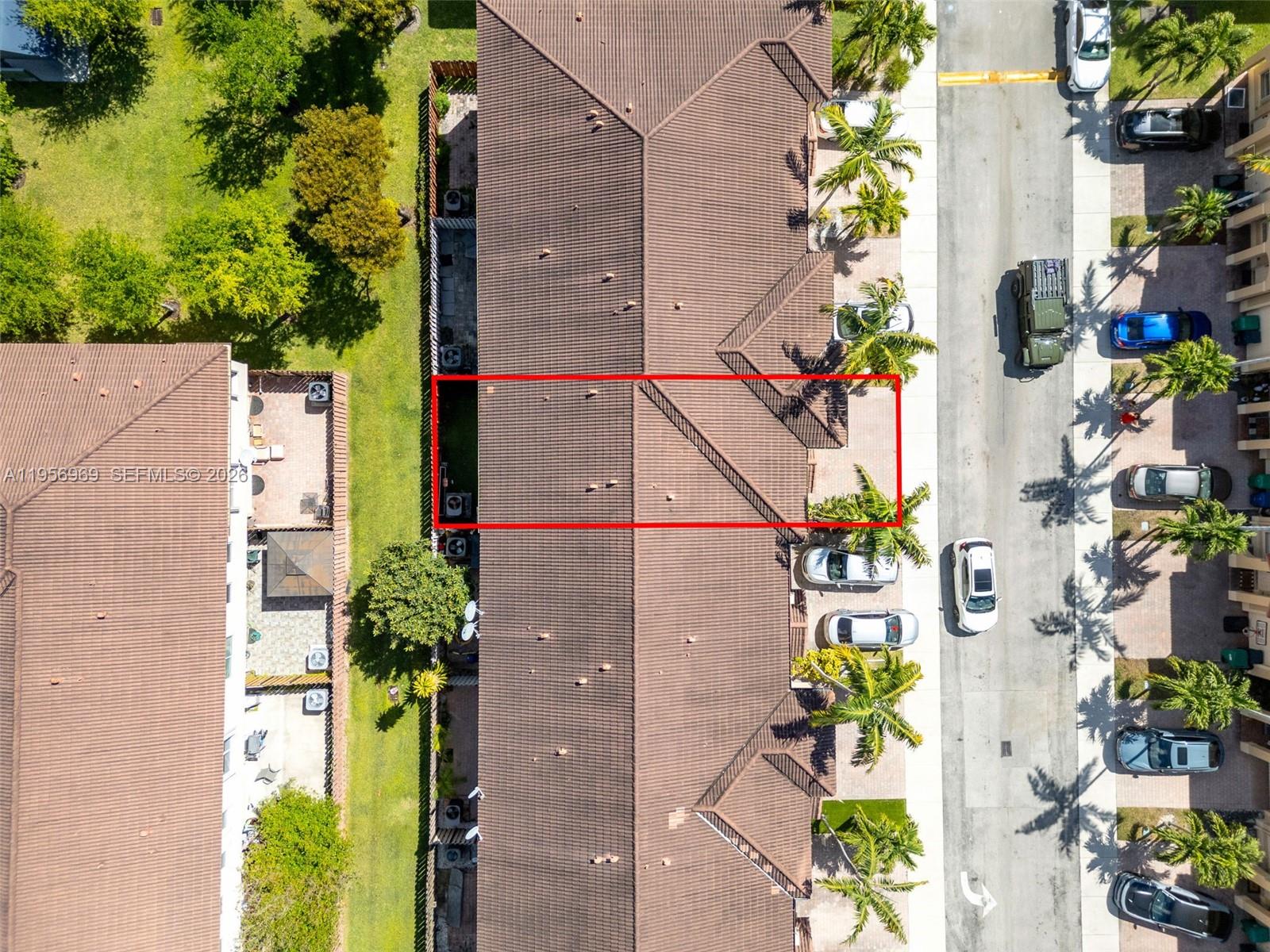 12965 Southwest 133rd Terrace Miami, FL 33186 - Photo 31 of 42 an aerial view of a house with a yard and wooden fence