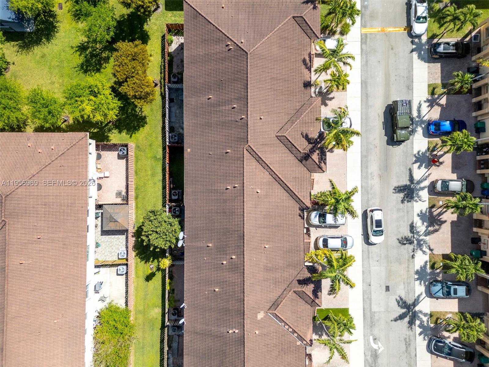 12965 Southwest 133rd Terrace Miami, FL 33186 - Photo 32 of 42 an aerial view of a house with a yard and garden