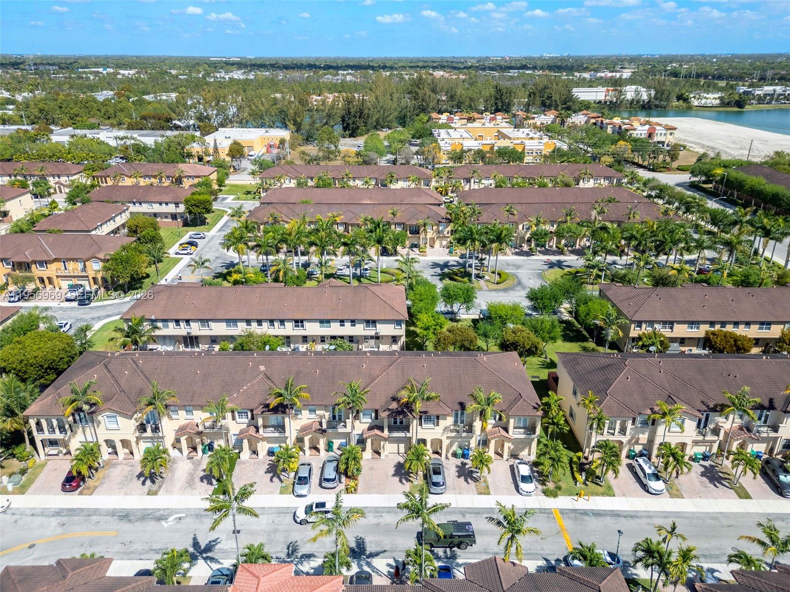 12965 Southwest 133rd Terrace Miami, FL 33186 - Photo 34 of 42 an aerial view of residential building and lake