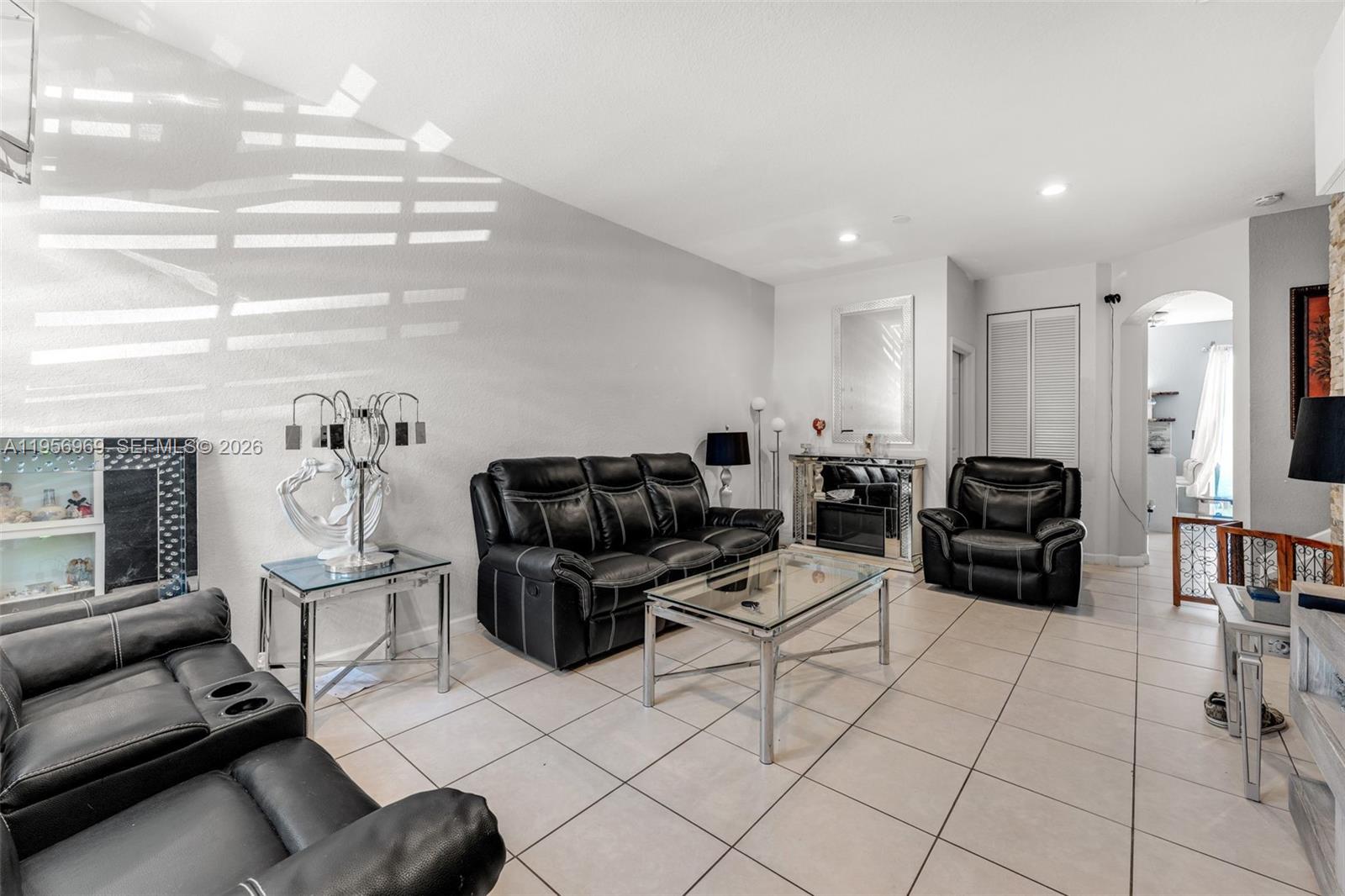 12965 Southwest 133rd Terrace Miami, FL 33186 - Photo 4 of 42 a living room with furniture