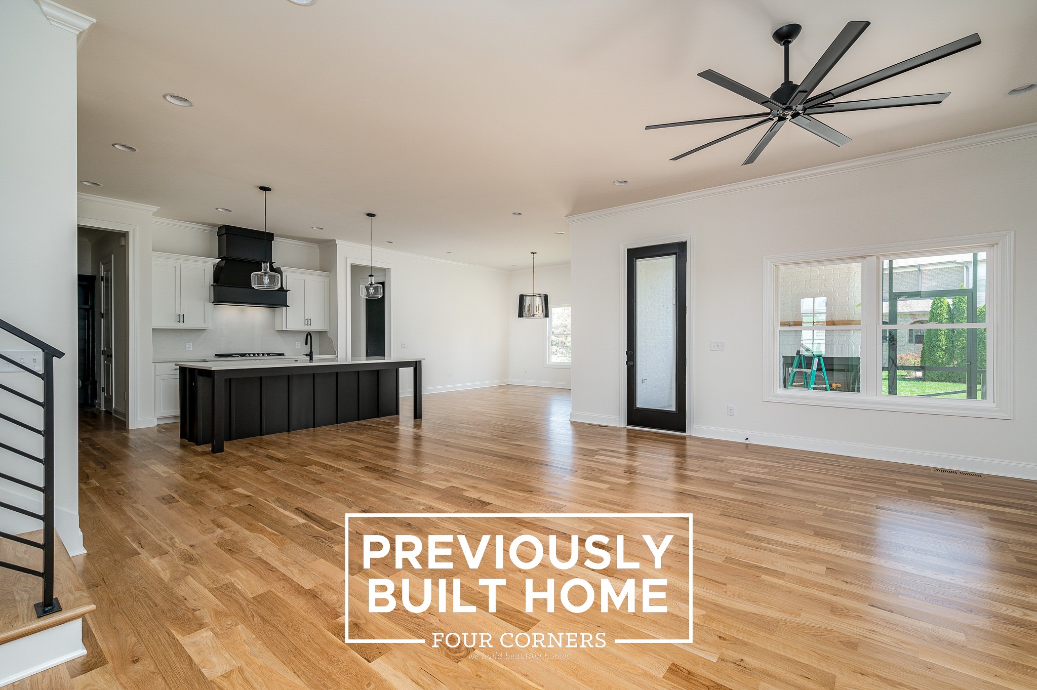 5422 Maroon Drive Murfreesboro, TN 37129 - Photo 7 of 35 a view of kitchen with kitchen island microwave and wooden floor