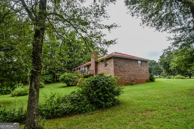 a backyard of a house with lots of green space