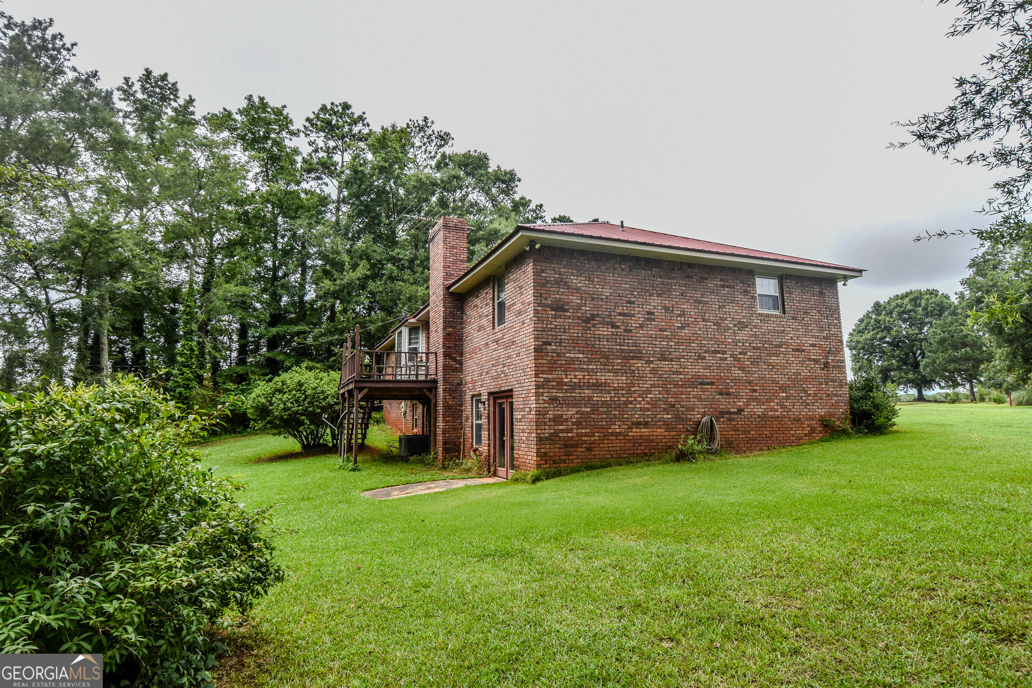 223 Ward Road Williamson, GA 30292 - Photo 12 of 51 a view of a backyard with potted plants and large tree