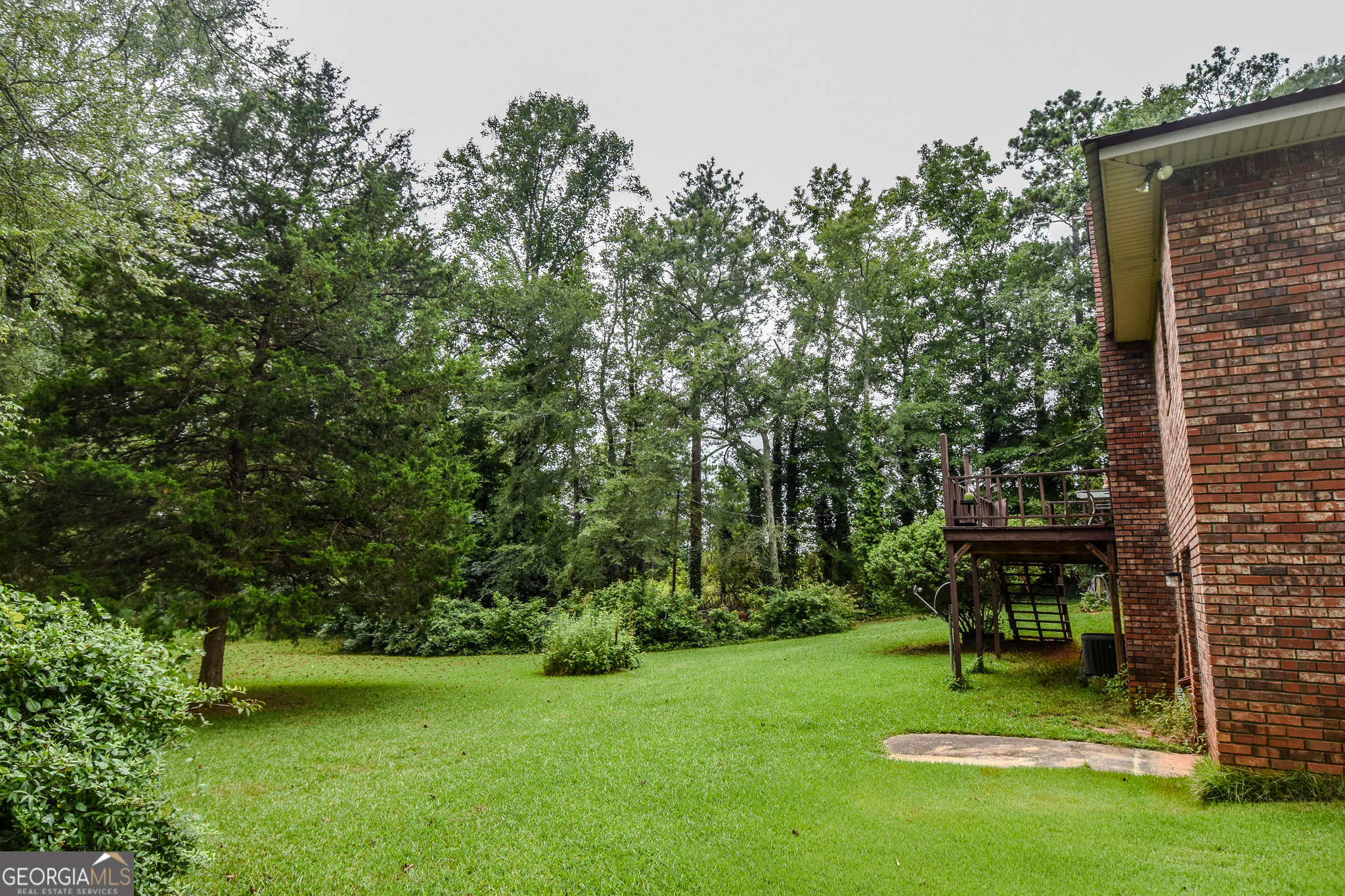 223 Ward Road Williamson, GA 30292 - Photo 17 of 51 a view of a table and chairs in the garden