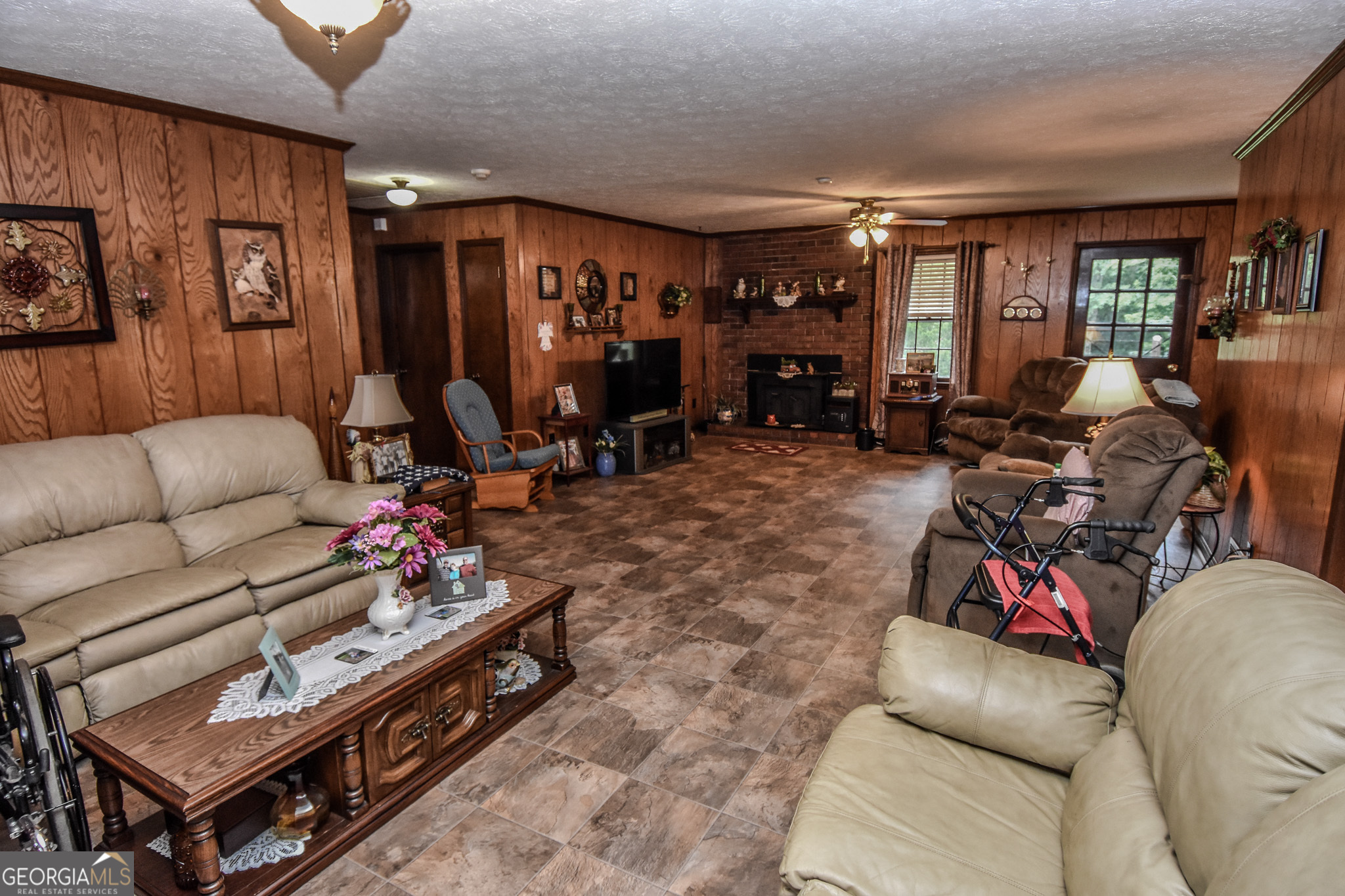 223 Ward Road Williamson, GA 30292 - Photo 24 of 51 a living room with furniture a dining table and a projector screen