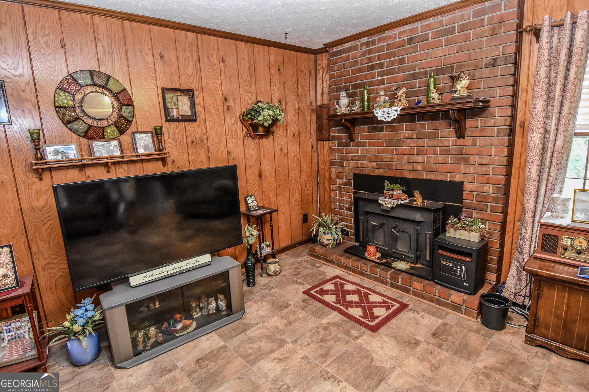 223 Ward Road Williamson, GA 30292 - Photo 26 of 51 a living room with furniture and a fireplace