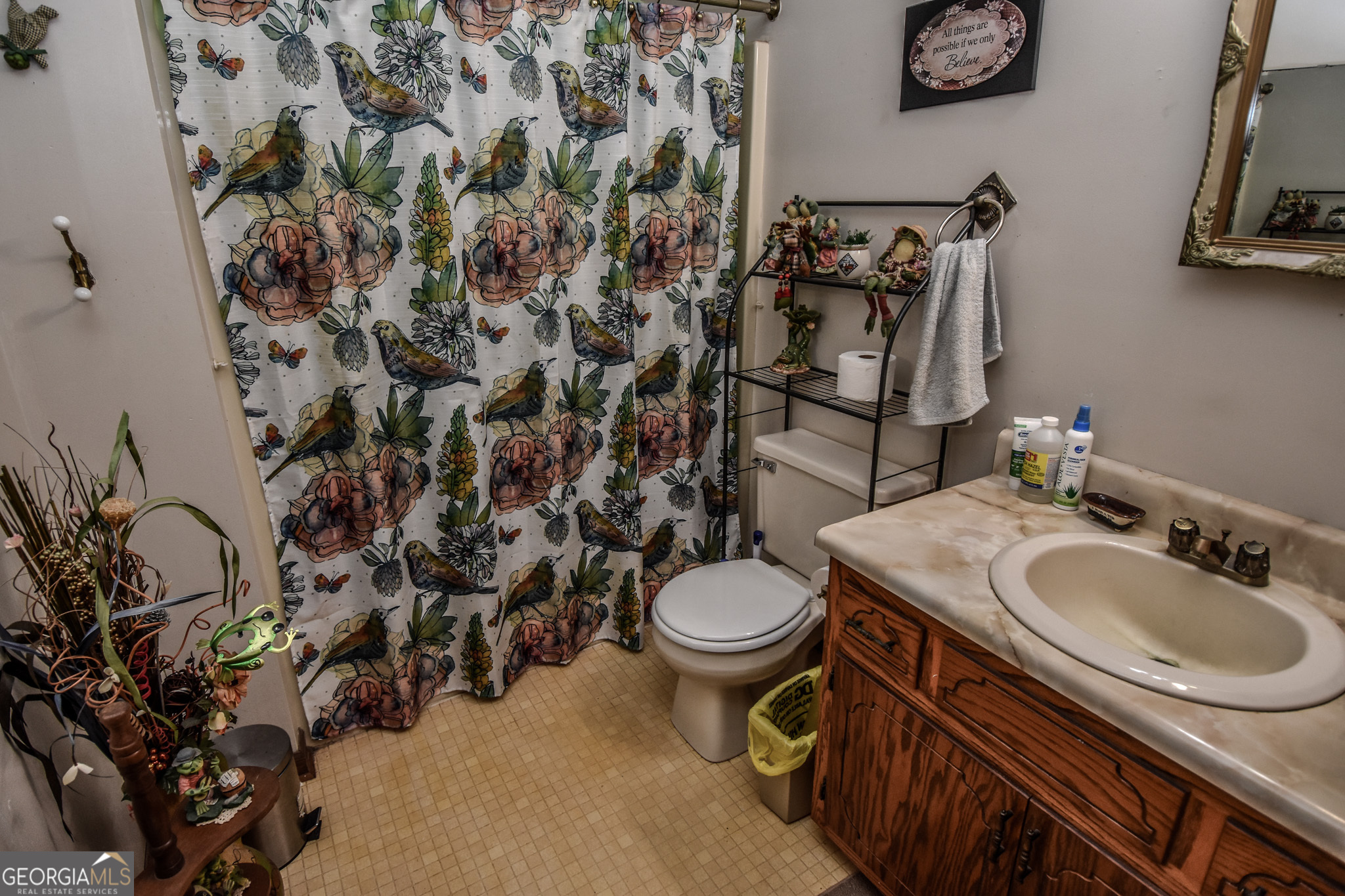 223 Ward Road Williamson, GA 30292 - Photo 30 of 51 a bathroom with a sink toilet and mirror