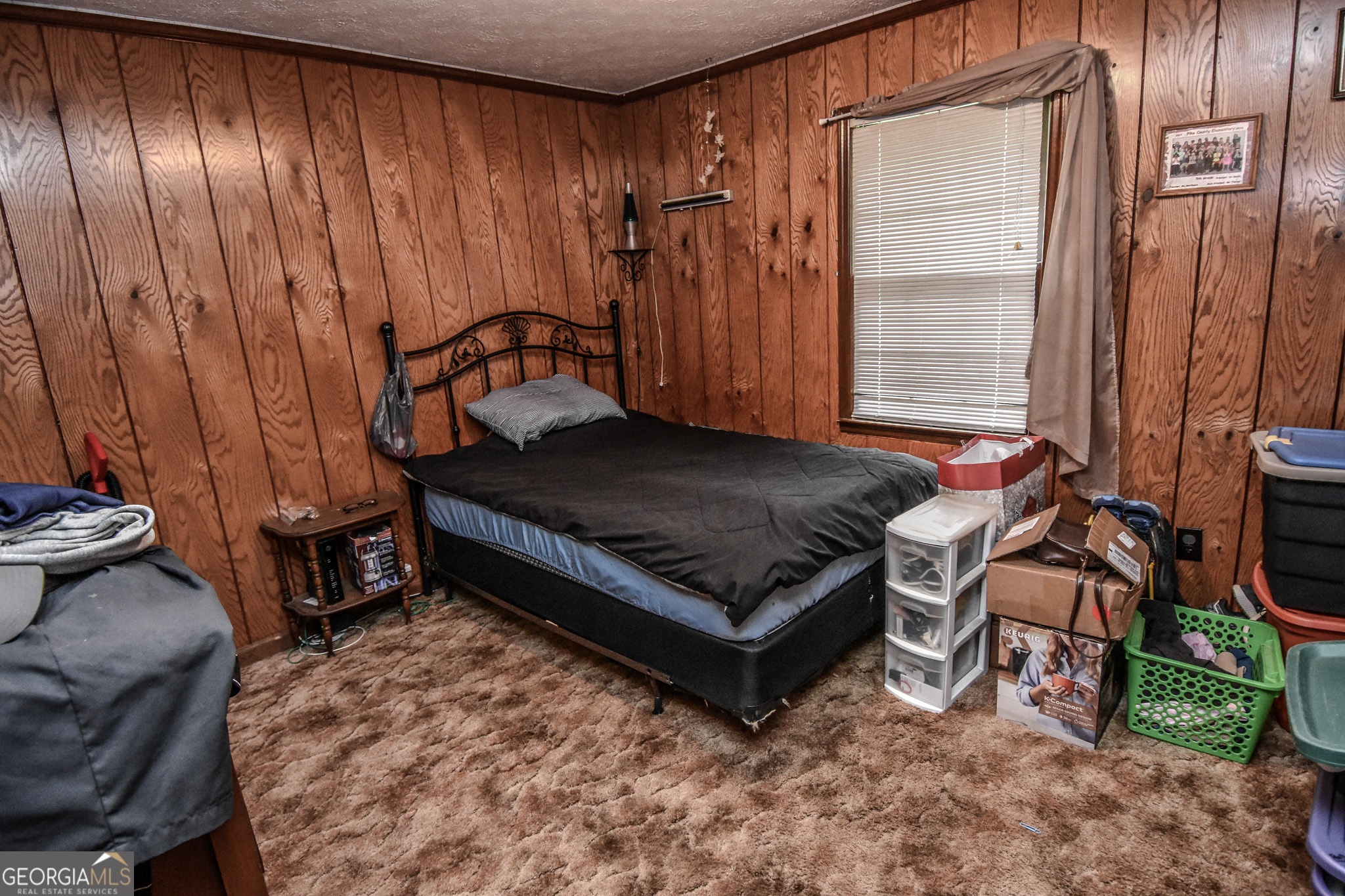 223 Ward Road Williamson, GA 30292 - Photo 32 of 51 a bed sitting in a room next to a window