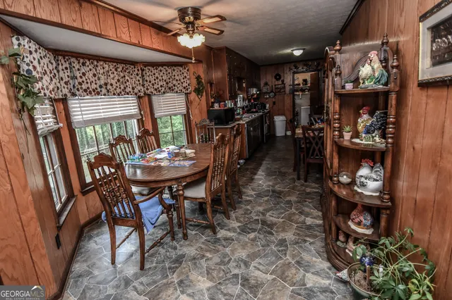 a view of a dining room with furniture window and outside view