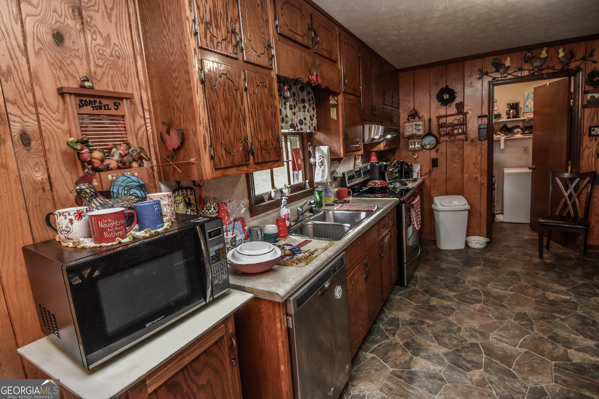 223 Ward Road Williamson, GA 30292 - Photo 38 of 51 a kitchen with a stove and a sink