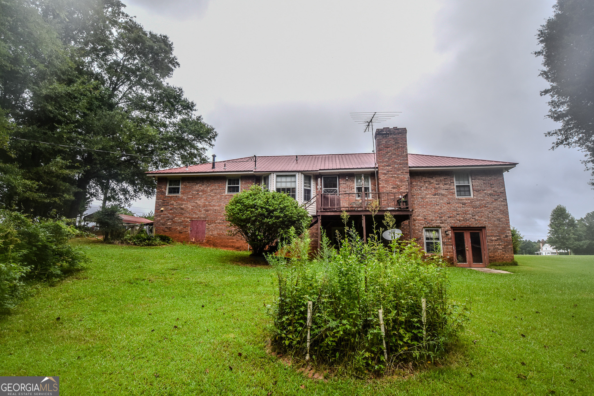 223 Ward Road Williamson, GA 30292 - Photo 8 of 51 a front view of a house with garden