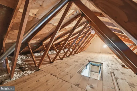 a view of hallway with wooden floor