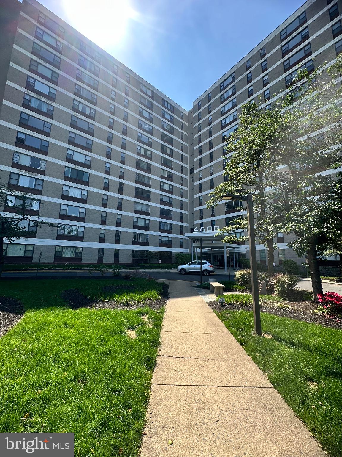 4600 Duke Street, Unit 701 Alexandria, VA 22304 - Photo 1 of 36 Modern apartment building with greenery.