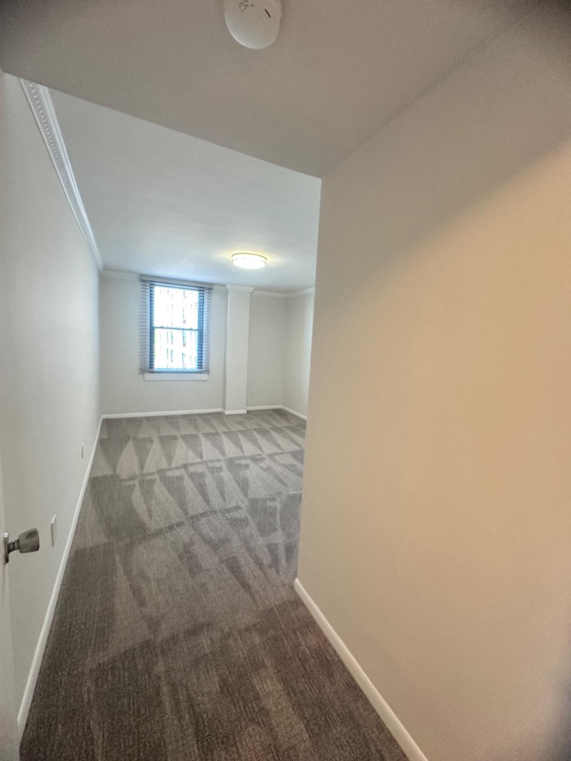 4600 Duke Street, Unit 701 Alexandria, VA 22304 - Photo 11 of 36 Spacious bedroom with natural light.